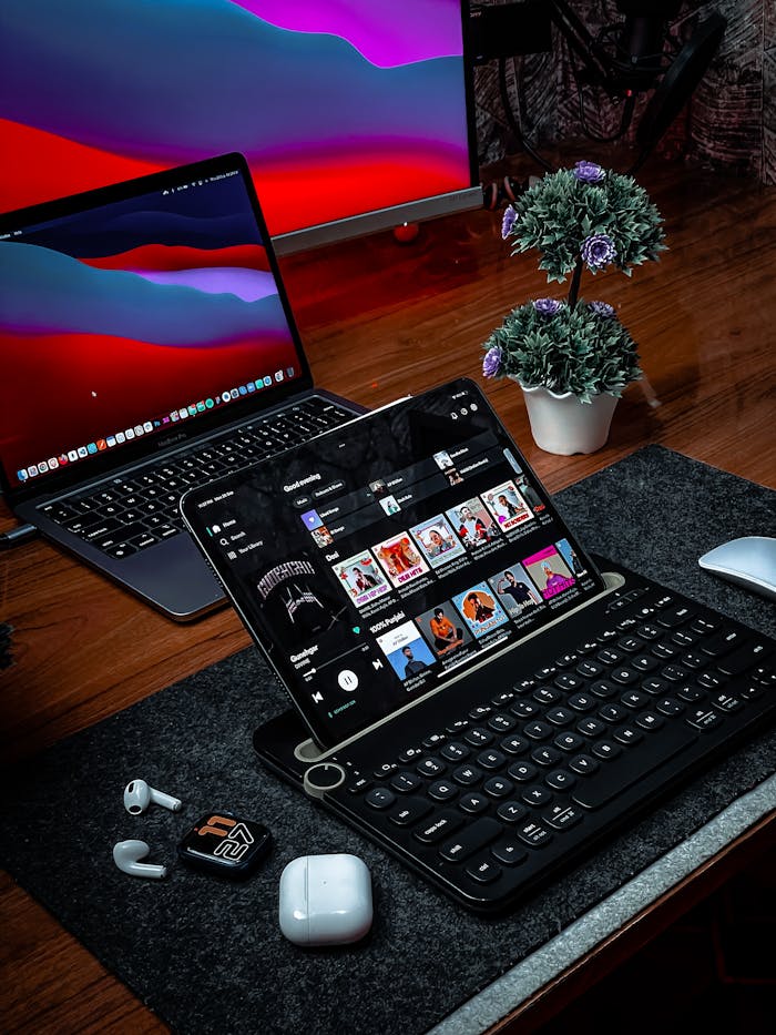 Stylish desk setup featuring Apple devices and tech accessories, perfect for productivity and creativity.